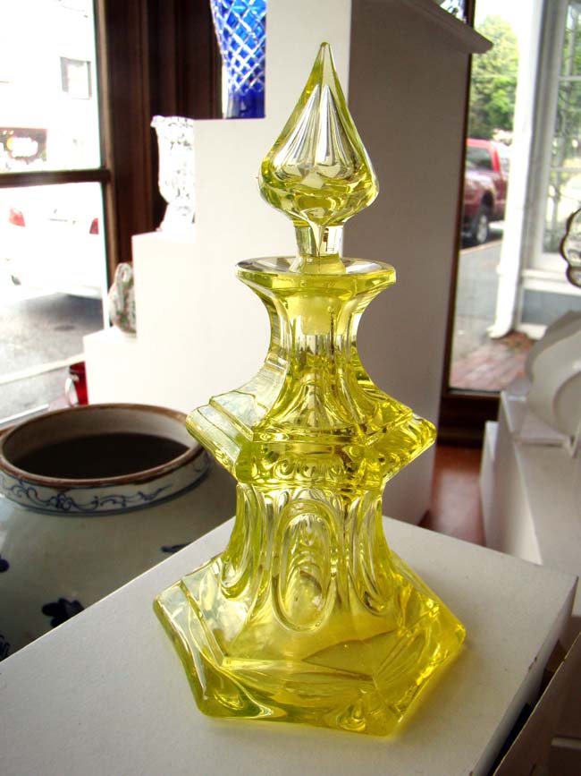 A beautiful antique canary yellow SANDWICH GLASS COMPANY cologne bottle in the loop pattern circa 1850